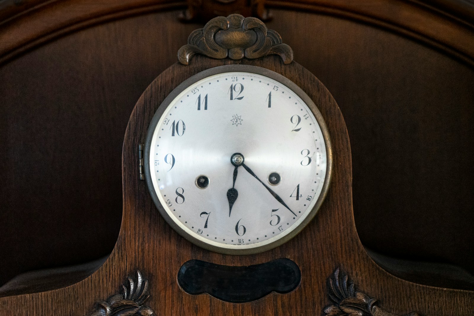 brown wooden framed analog wall clock